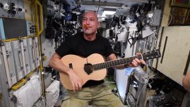 ESA (European Space Agency) astronaut Luca Parmitano displaying both his kazoo and guitar skills during karaoke with his fellow crew members.